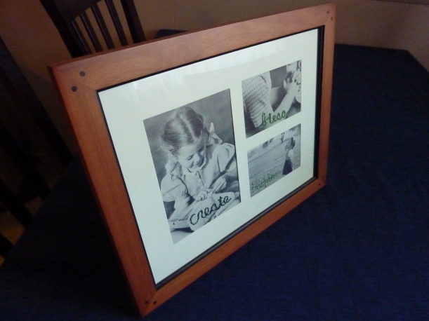 embroidered black and white photos in frame